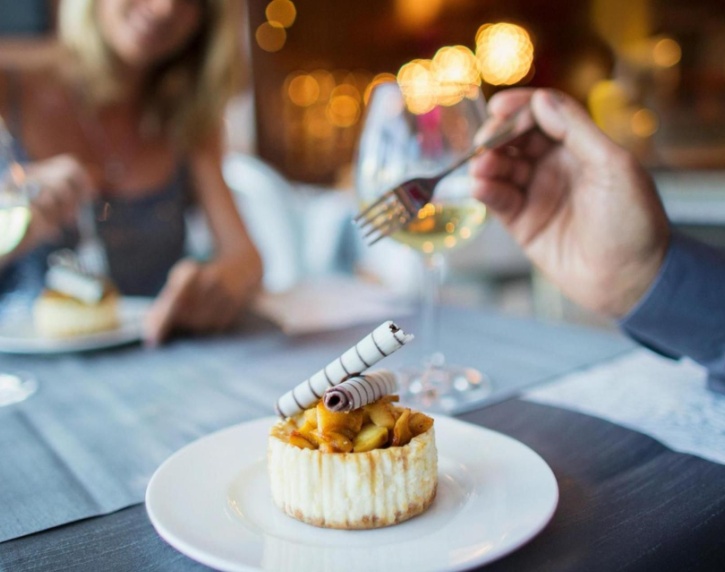 A couple enjoying a meal in a restaurant.